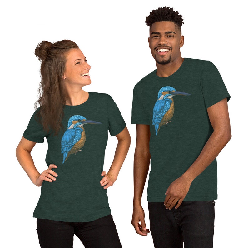 May include: Two people wearing dark green t-shirts with a blue and brown kingfisher bird graphic printed on the front.
