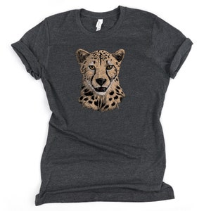 May include: A dark heather grey t-shirt with a cheetah face graphic printed on the front.