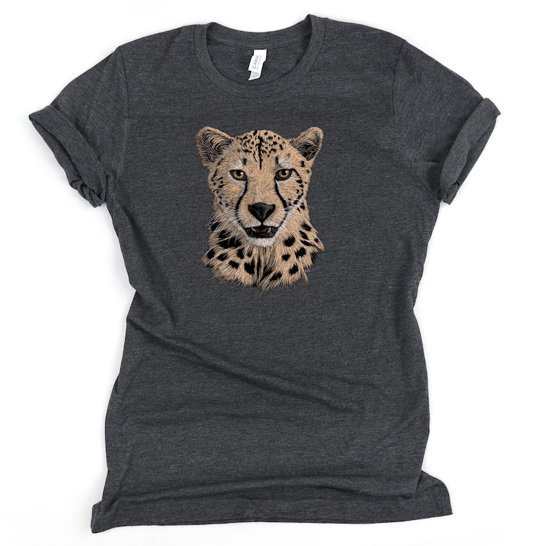 May include: A dark heather grey t-shirt with a cheetah face graphic printed on the front.