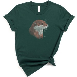 May include: A dark green t-shirt with a brown and white otter illustration on the front. The otter is looking to the right and has a white whisker.