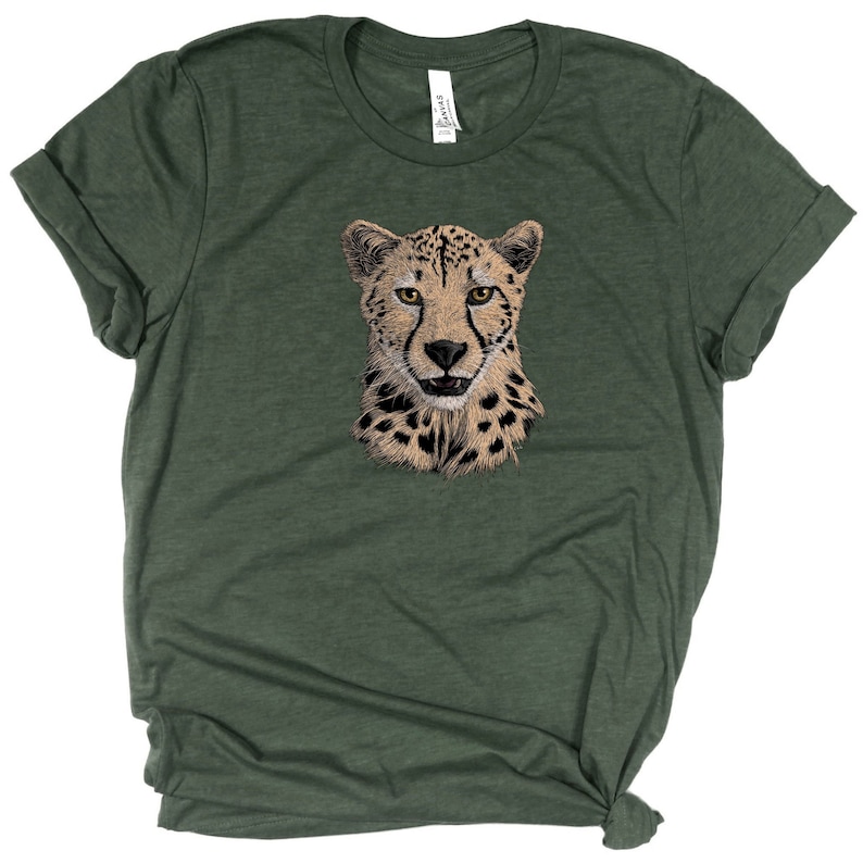 May include: A green t-shirt with a cheetah graphic printed on the front.