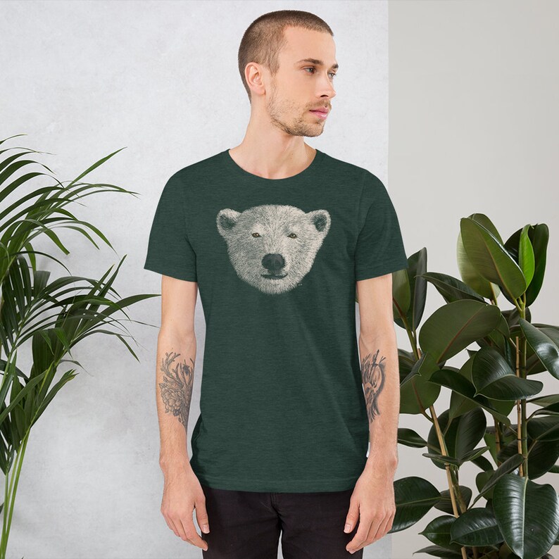 May include: A dark green t-shirt with a white polar bear face graphic printed on the front.