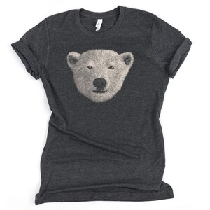 May include: A dark heather grey t-shirt with a white polar bear face graphic printed on the front.