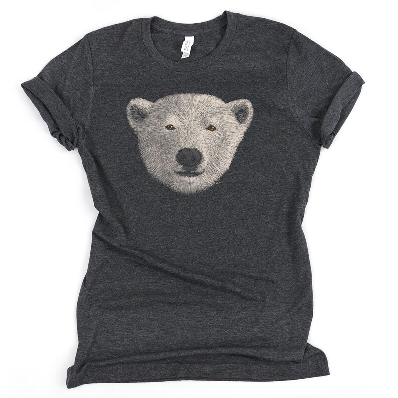 May include: A dark heather grey t-shirt with a white polar bear face graphic printed on the front.