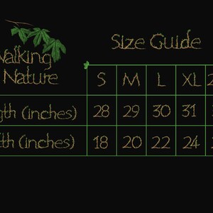 May include: A size guide for apparel, featuring the text "Walking In Nature." The guide displays measurements in inches for length and width across sizes S to 2XL. Length measurements range from 28 to 32 inches, and width from 18 to 26 inches.