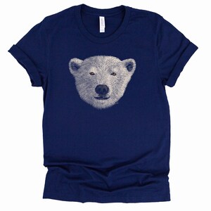May include: A navy blue t-shirt featuring a white polar bear face graphic.