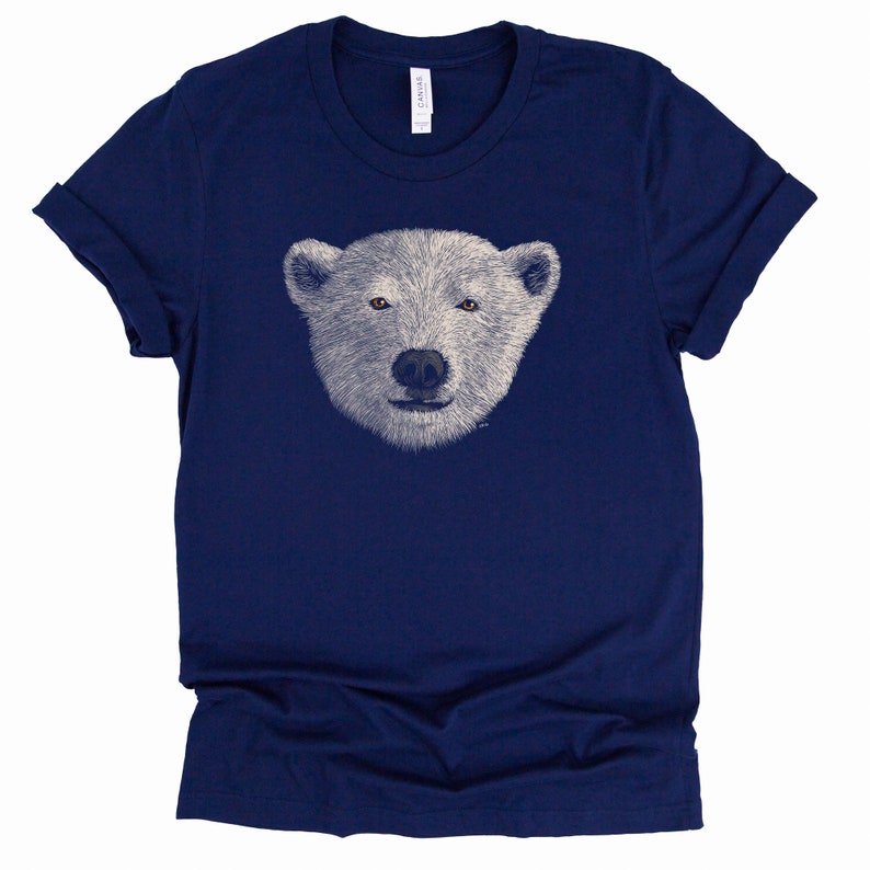 May include: A navy blue t-shirt featuring a white polar bear face graphic.