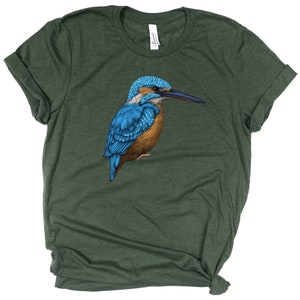 May include: A green t-shirt with a blue and brown kingfisher bird illustration.