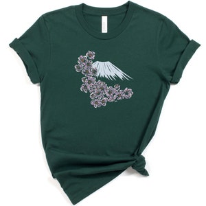 May include: A dark green t-shirt with a white graphic of Mount Fuji and pink cherry blossoms.