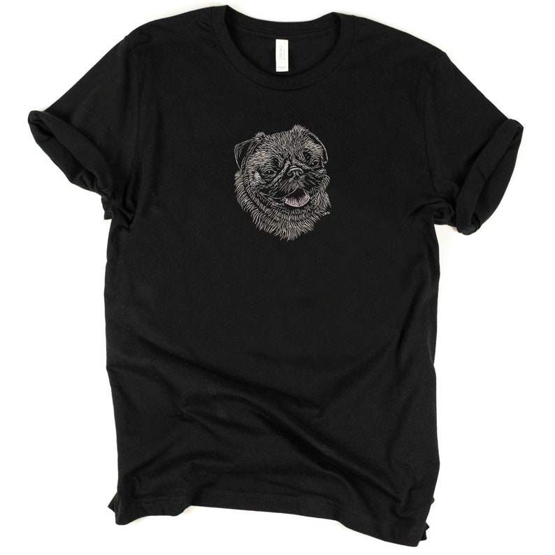Puede incluir: Camiseta negra con un dibujo de l&iacute;nea blanca de la cara de un perro pug en la parte delantera.