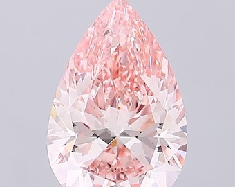 May include: A pear-shaped pink diamond with a light pink hue. The diamond has a brilliant cut and is set in a simple setting.