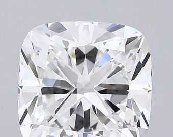 May include: A close-up of a cushion-cut diamond. The diamond is clear and colorless, with many facets that reflect light. The shape is square with rounded corners, and the overall appearance is brilliant and sparkling.