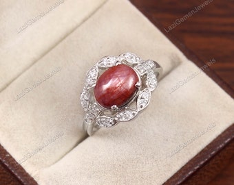 Sterlingzilveren ring met robijn ster: ovale cabochon, geboortesteen juli