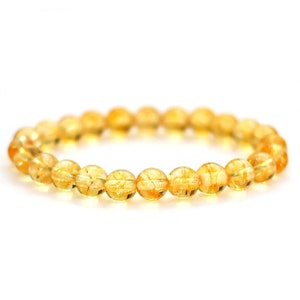 Peut inclure: Un bracelet en citrine jaune avec des perles rondes.