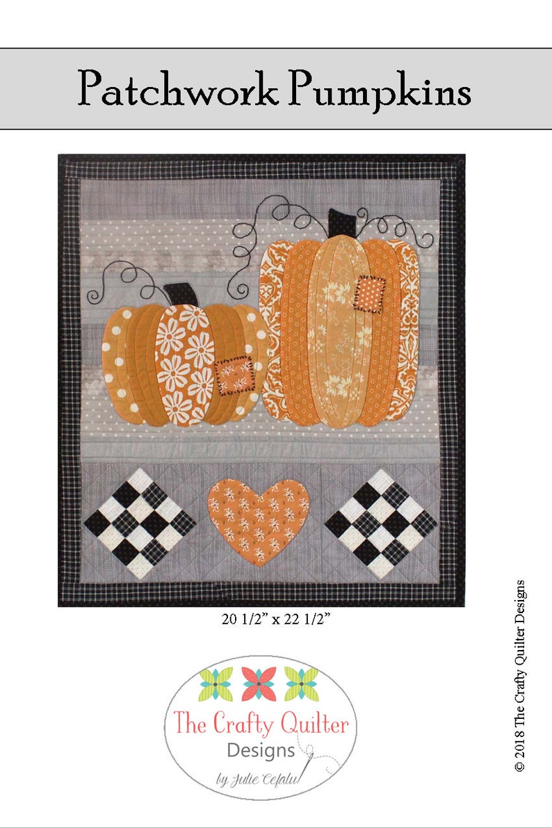 May include: A patchwork quilt featuring two orange pumpkins with different patterns, a heart, and a black and white checkered pattern. The quilt is 20 1/2 inches by 22 1/2 inches and is titled "Patchwork Pumpkins".