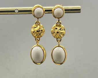 Earrings with white cabochons