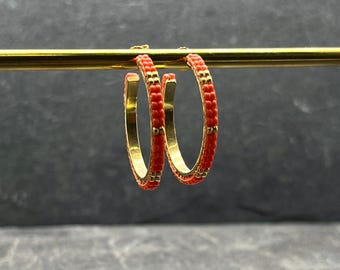 Gold hoop earrings with orange Miyuki glass beads