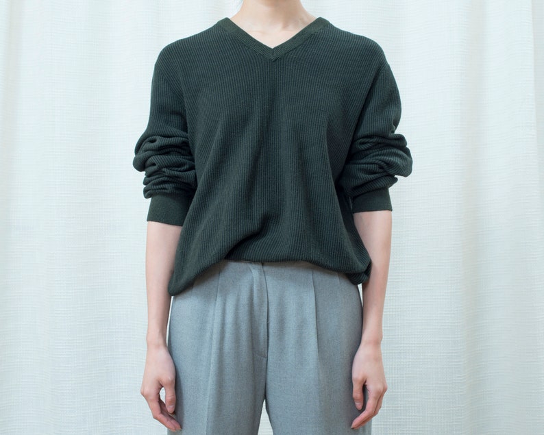 dark green sweater