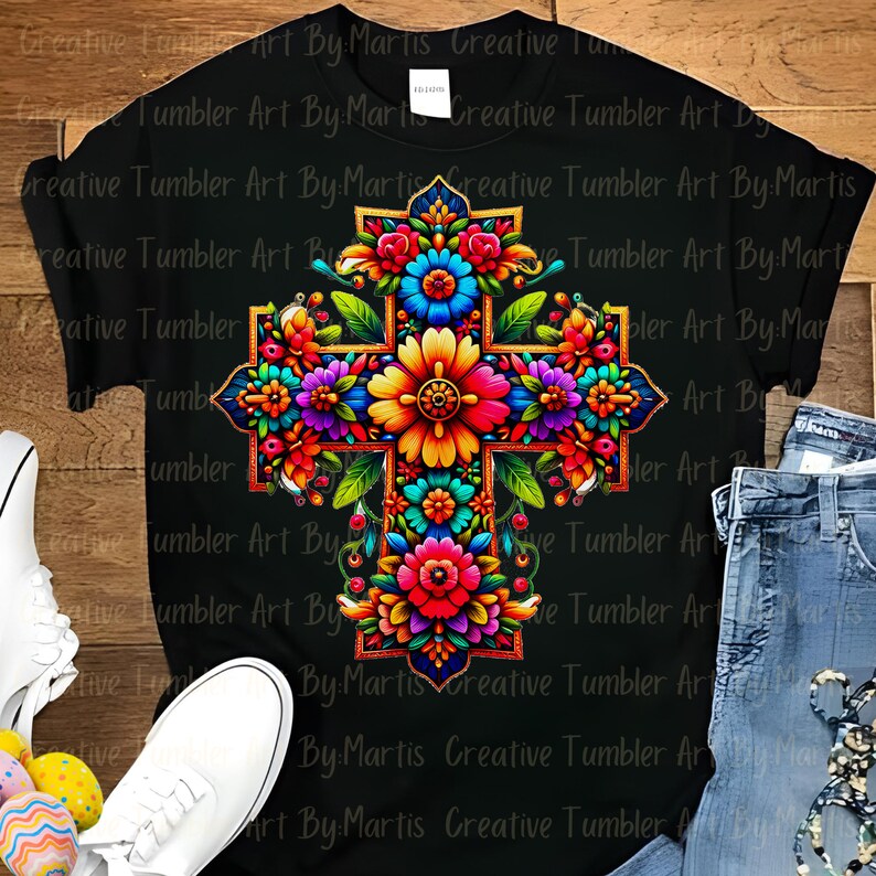 May include: A colorful floral cross with a black background. The cross is decorated with bright pink, yellow, orange, blue, and green flowers.