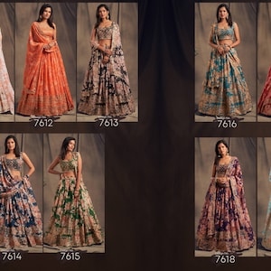 May include: A collection of women's lehengas in various colors and floral patterns. The lehengas include a skirt, a cropped top, and a matching scarf. Each outfit has a unique design, with colors ranging from white to red, blue, and green. The numbers 7611-7619 are printed on the bottom.