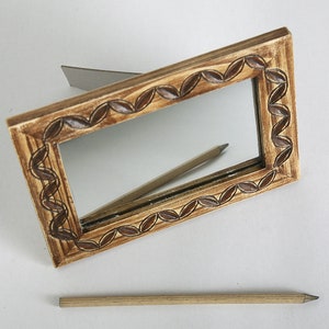 Hand carved mirror frame