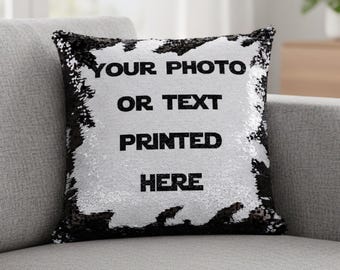 May include: A square throw cushion featuring reversible sequins that transition between black and white. The centre displays the black text YOUR PHOTO OR TEXT PRINTED HERE against a white sequin background, framed by a black sequin border.