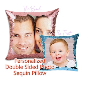 May include: Two square sequin pillows featuring custom photo prints. The larger pillow displays a couple in rose gold sequins, labeled The Back. The smaller pillow shows a smiling baby in blue sequins, labeled The Front. Text reads Personalized Double Sided Photo Sequin Pillow.