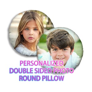 May include: Round pillow with two children's portraits. The pillow has the text "PERSONALIZED DOUBLE SIDED PHOTO ROUND PILLOW" in a colorful font. One portrait is of a girl with blonde hair and the other is of a boy.