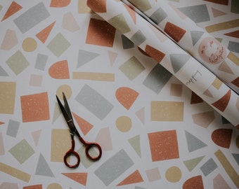 Inpakpapier met kleurrijke geometrische vormen: gerecyclede cadeauverpakking van A2-formaat