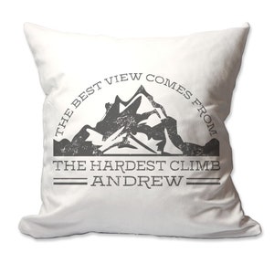 May include: White throw pillow with a black and gray mountain graphic and the text "The best view comes from the hardest climb Andrew".