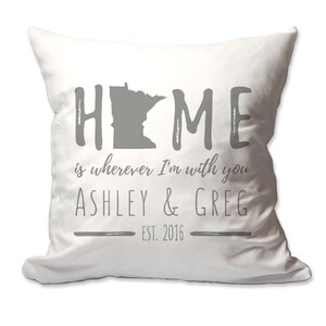 May include: White throw pillow with gray text that reads "HOME is wherever I'm with you ASHLEY & GREG EST. 2016". The text is in a handwritten font. The state of Minnesota is depicted in gray in the middle of the word "HOME".