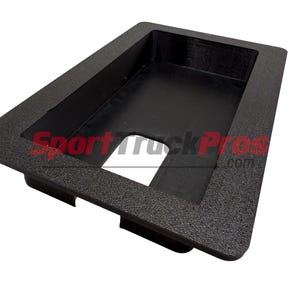 May include: A black rectangular plastic tray with a textured surface and a rectangular cutout. The tray has a raised border and the text "SportTruckPros.com" is visible.