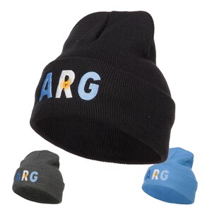 May include: Three knitted beanies in black, gray, and blue with the word "ARG" embroidered on the front. The black beanie has a blue and white embroidered flag of Argentina.
