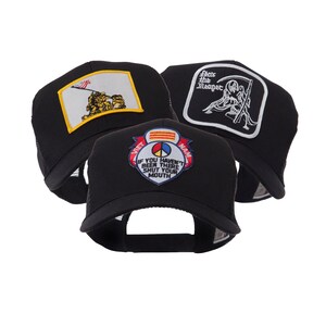 May include: Three black trucker hats with different embroidered patches. One hat features a US flag and soldiers, another has a grim reaper design, and the third displays text that reads "IF YOU HAVEN'T BEEN THERE SHUT YOUR MOUTH".