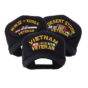 May include: Three black baseball caps with embroidered patches. One reads "WWII - KOREA VETERAN", another "DESERT STORM VETERAN", and the third "VIETNAM VETERAN". Each patch features colorful ribbons and text in gold.