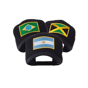 May include: Three black baseball caps with embroidered patches featuring the flags of Brazil, Argentina, and Jamaica. The flags are in their respective colors, with the Brazilian flag having a green background, the Argentinian flag having a light blue background, and the Jamaican flag having a yellow cross.