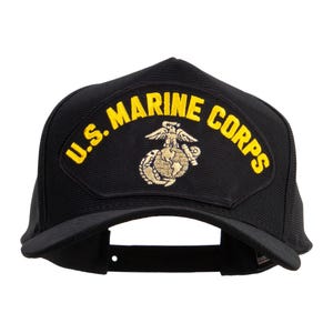 May include: Black baseball cap with the words "U.S. MARINE CORPS" in yellow, curved across the front. A gold emblem of an eagle, globe, and anchor is centered below the text. The cap has a curved peak and a structured crown.