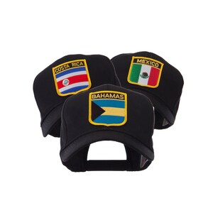 May include: Three black baseball caps with embroidered patches featuring the flags of Costa Rica, Mexico, and the Bahamas. The Costa Rica patch has red, white, and blue stripes. The Mexico patch has green, white, and red stripes. The Bahamas patch has a black triangle, yellow, and blue stripes.
