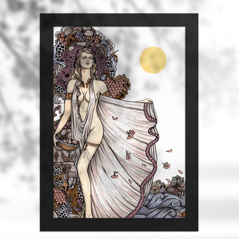 May include: A framed art print featuring a stylized illustration of a figure in a flowing white garment, holding a bowl of fruit. The background includes intricate patterns, a golden sun, and stylized waves, all enclosed in a black frame.