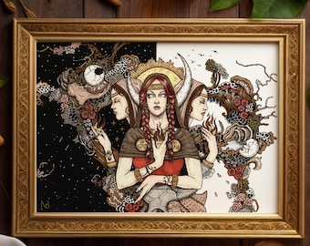 May include: A framed art print featuring a central figure with three faces, red braided hair, and a golden crescent moon crown. The illustration displays a split black and white background with intricate botanical, celestial, and flame motifs.
