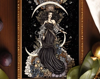 May include: A framed art print featuring a central figure in a long black gown standing before a large white crescent moon. The illustration includes gold accents, dark roses, stars, and a classical column against a deep black starry background.