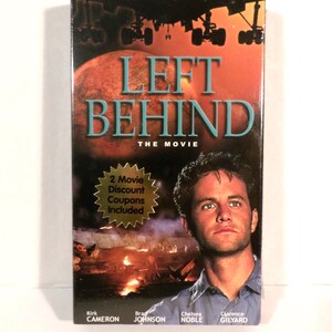May include: A VHS tape for the movie "Left Behind." The cover features a man's portrait, the title in teal letters, and a fiery background with the text "From the Runaway Best-Selling Novel."