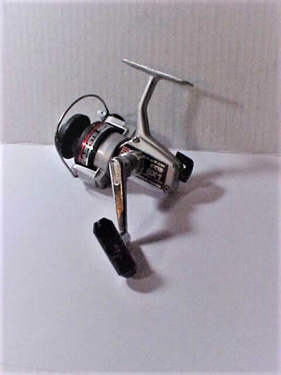 RYOBI Silver Cloud SX1 Spinning Reel W/graphite Spool Circa 1990s Pre-owned  in Very Good Plus Working Condition No Box, Action Smooth/strong 