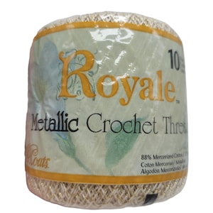 May include: A spool of Royale Metallic Crochet Thread. The label is light green with gold lettering and accents. The text on the label reads "Royale Metallic Crochet Thread" and "Coats". The thread is a light gold color.