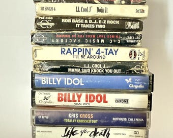 May include: A stack of cassette tapes featuring artists such as DJ Girl Katalina, LL Cool J, Rob Base & DJ E-Z Rock, C+C Music Factory, Rappin' 4-Tay, Billy Idol, Kris Kross, Life After Death, DJ Shadow, and Billy Ocean.