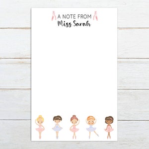 May include: A note pad with a white background and a pink ballerina shoe design at the top. The text "A note from Miss Sarah" is printed at the top of the page. The bottom of the page features five cartoon ballerinas in pink tutus.