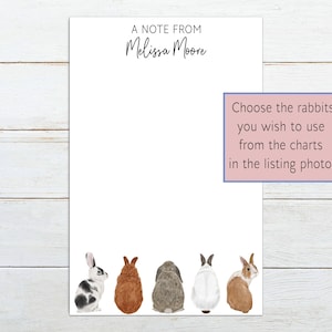 May include: White notepad with the text "A Note From Melissa Moore" at the top. The bottom of the notepad features watercolor illustrations of five different rabbits. A pink box on the right side contains text that reads "Choose the rabbits you wish to use from the charts in the listing photos."