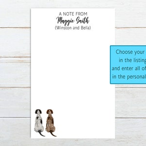 May include: A white card with the text "A Note From Maggie Smith (Winston and Bella)" at the top. The card has two illustrations of dogs sitting on the bottom. The text "Choose your dog breed in the listing photos and enter all of the names in the personalization box." is in a blue box on the right side of the card.