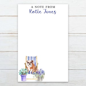 May include: A note pad with a white background and a bulldog wearing sunglasses sitting in a blue and white striped beach chair. The text "A note from Katie Jones" is at the top of the pad.