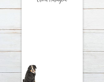 May include: White stationery featuring the name "Olivia Kensington" in black script. A watercolour illustration of a Bernese Mountain Dog is at the bottom left. The dog is black, white, and brown.